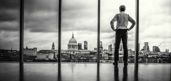 Person_overlooking_town_decisions_duotone